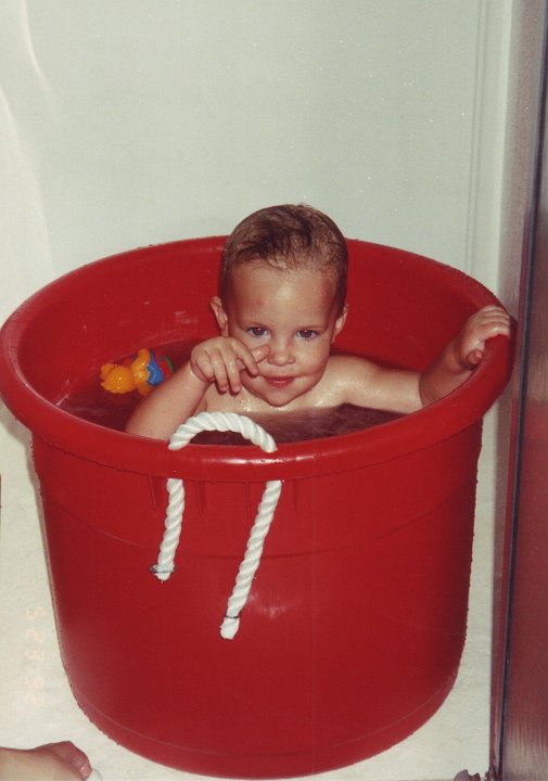 1992_05_23_Heather1.jpg - May 23, 1992 - muck bucket bath at the Cabin