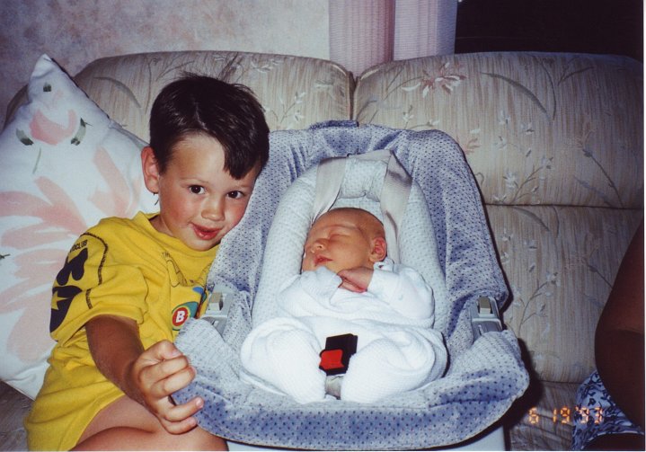 1993_06_19_T&S.jpg - Travis with Stephanie when she comes home - June 19, 1993