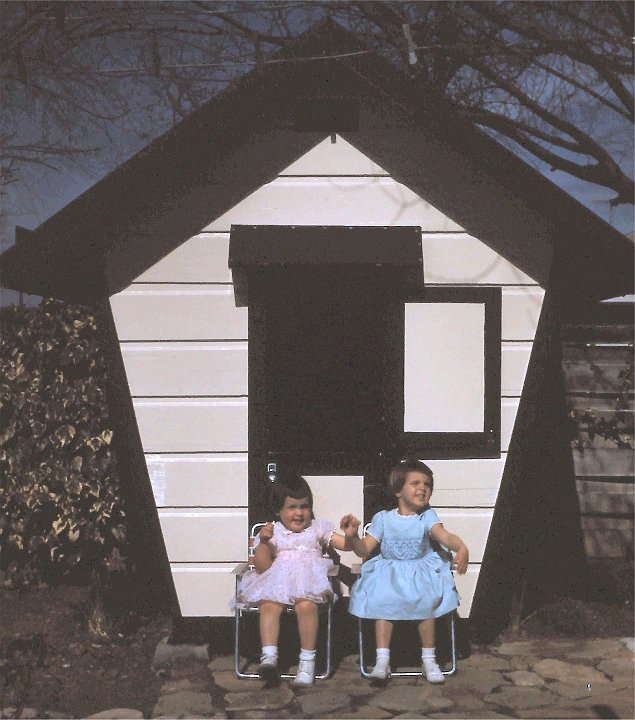 1962_02a.jpg - Sitting in front of the playhouse - February 1962